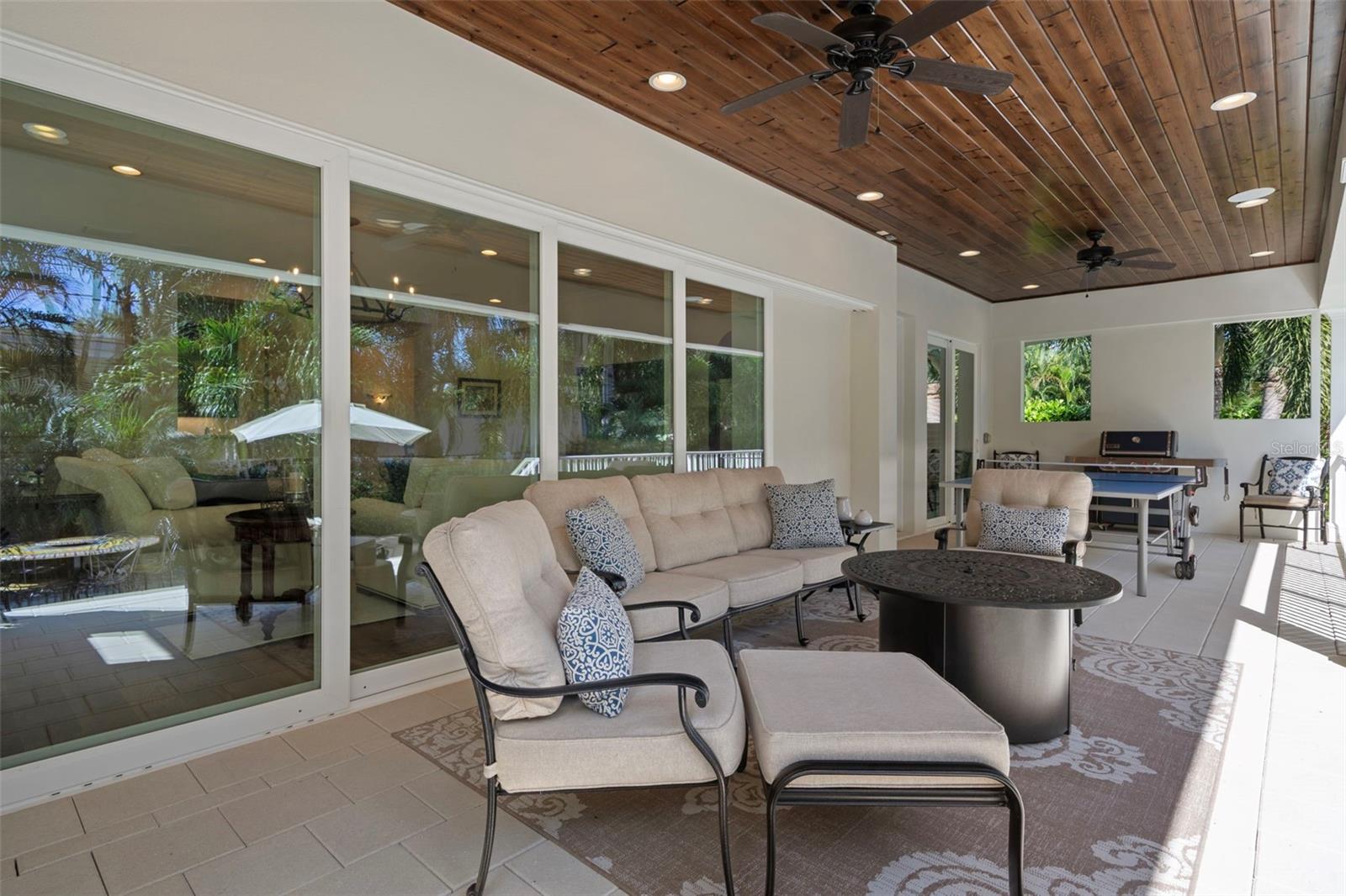 Expansive outdoor living & dining area with outdoor grill