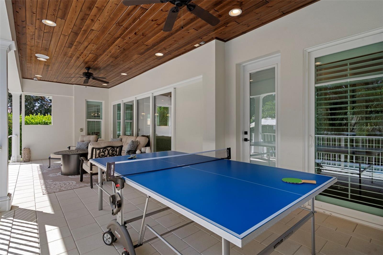 Covered lanai with space for games & entertaining