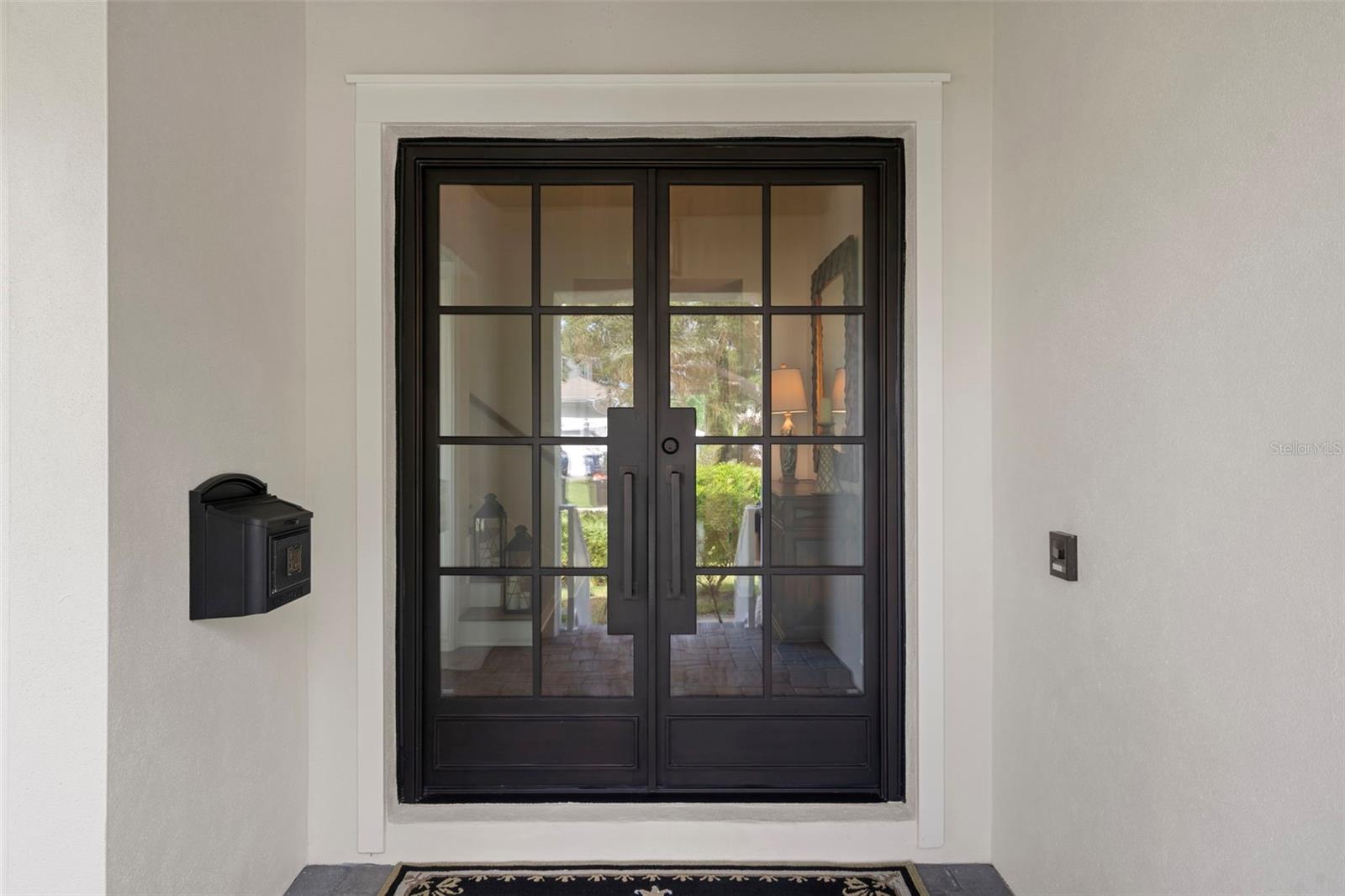 Beautiful new Iron and storm proof glass graces this home!  Absolutely gorgeous!!