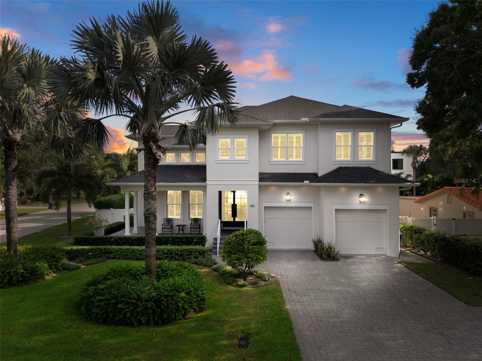 Enjoy your front porch at twilight! Gorgeous brick pavers and elegant facade!