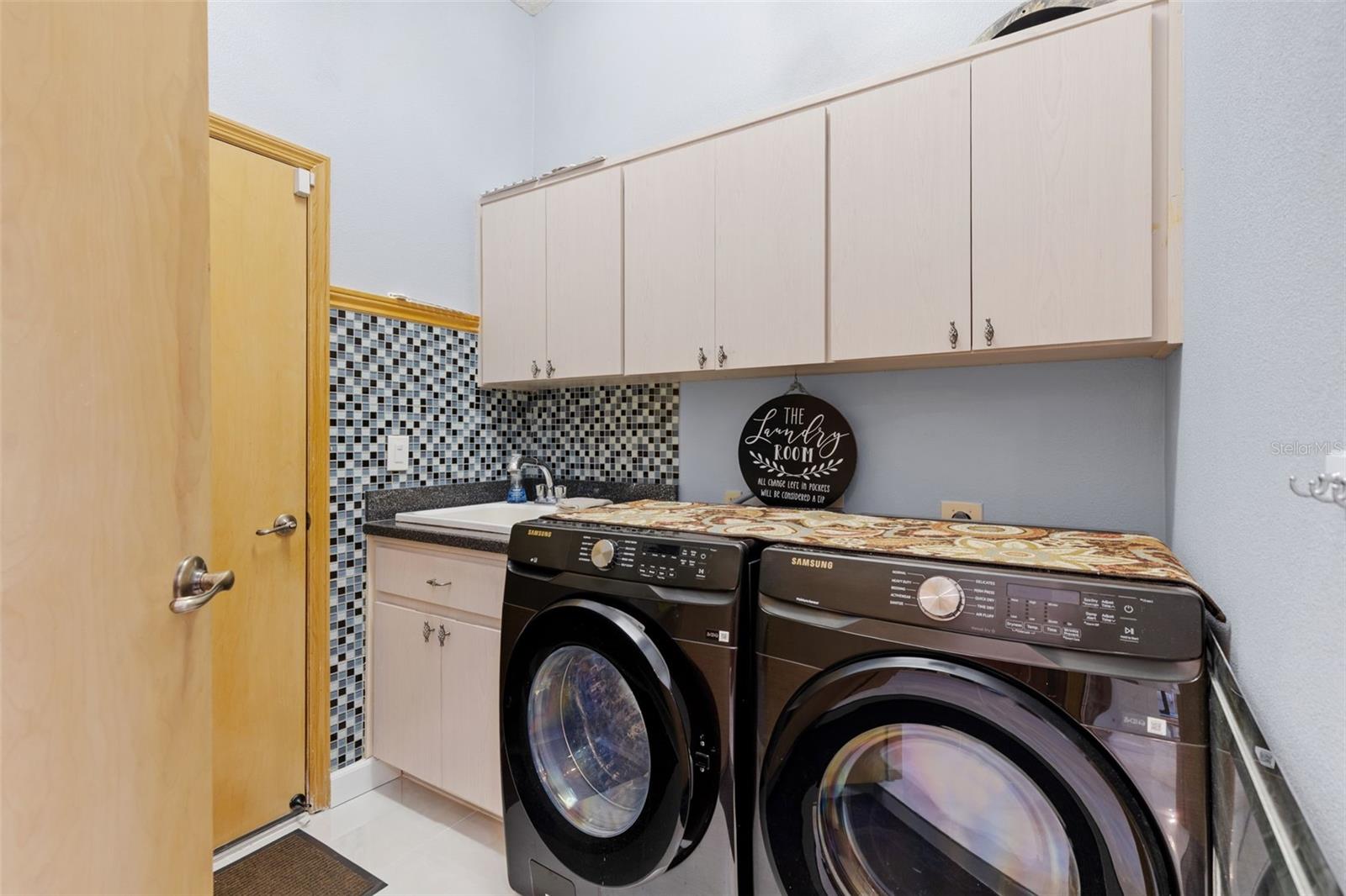 Laundry off kitchen and leading to 3 car garage