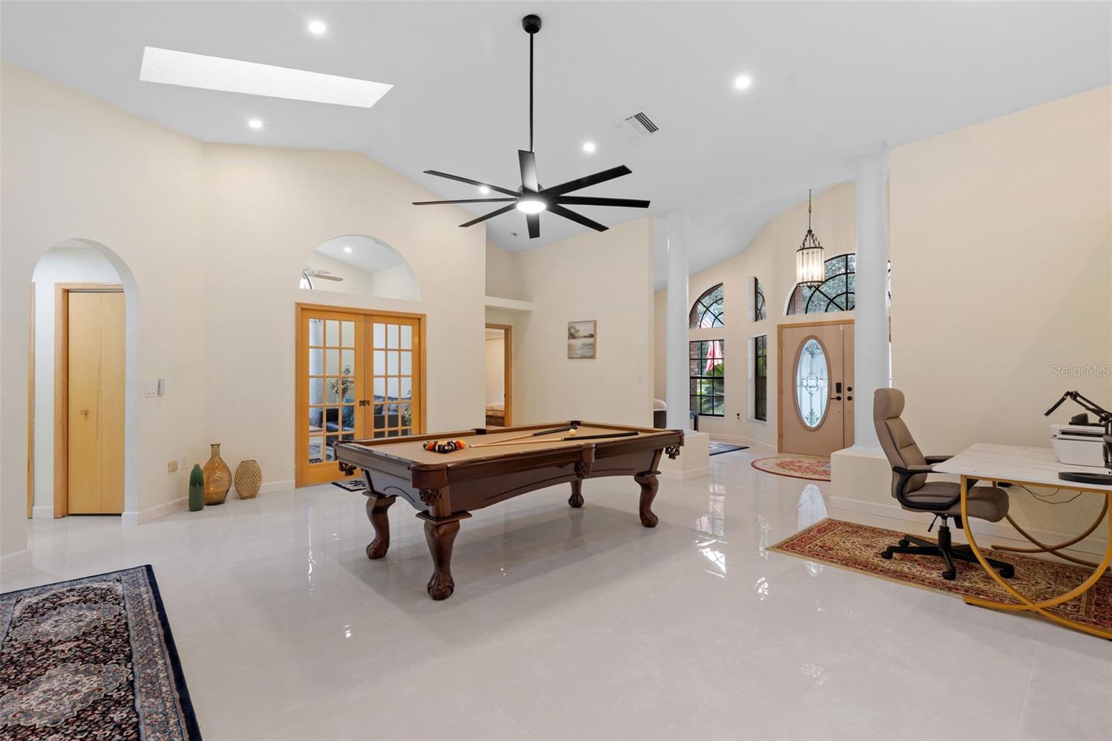 Beyond the French sliding pocket doors is the current casual living/media room. This room can thoughtfully be  designed to evolve to your lifestyle.