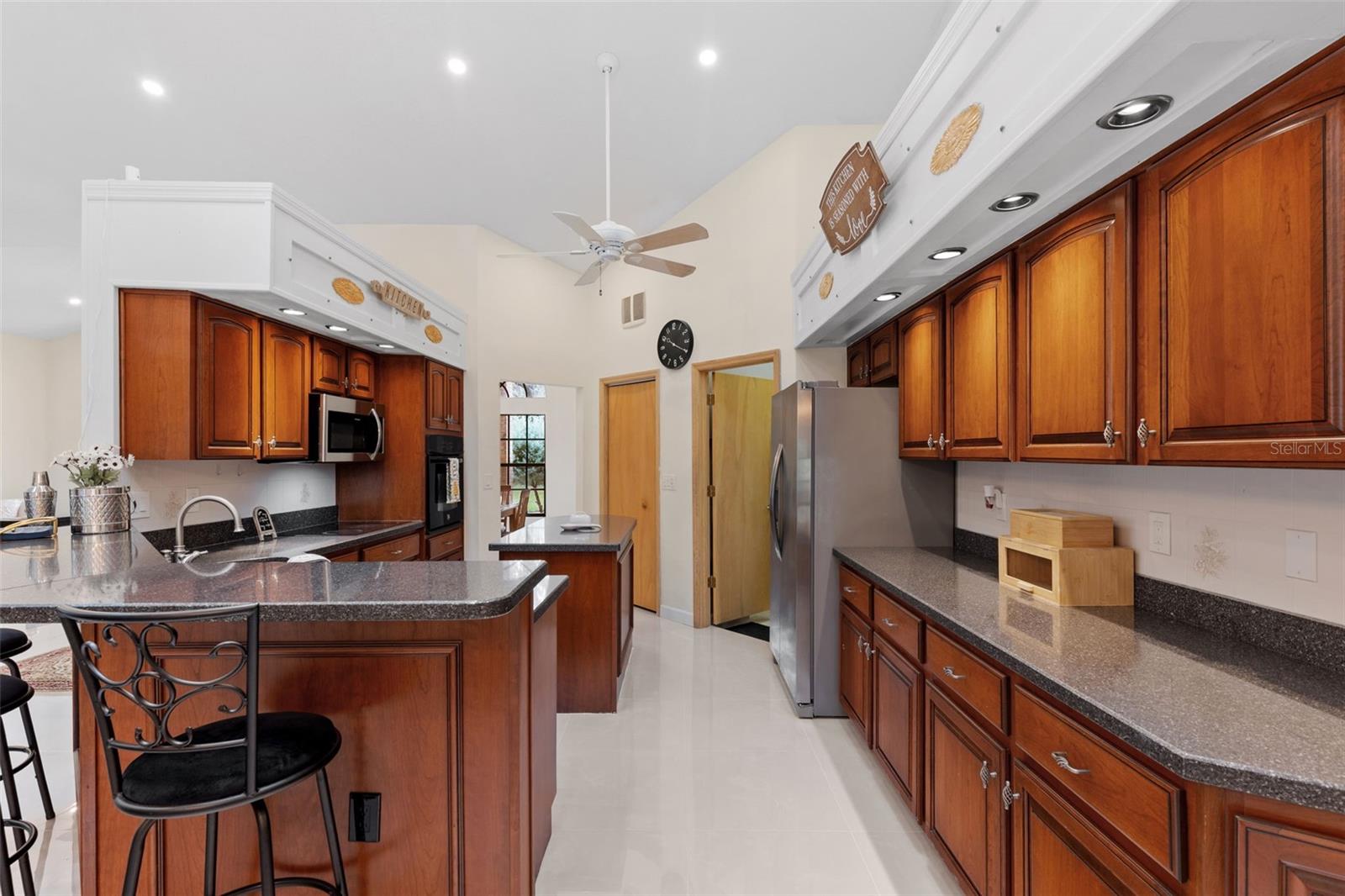 Straight ahead, access to laundry room and 3 car garage beyond