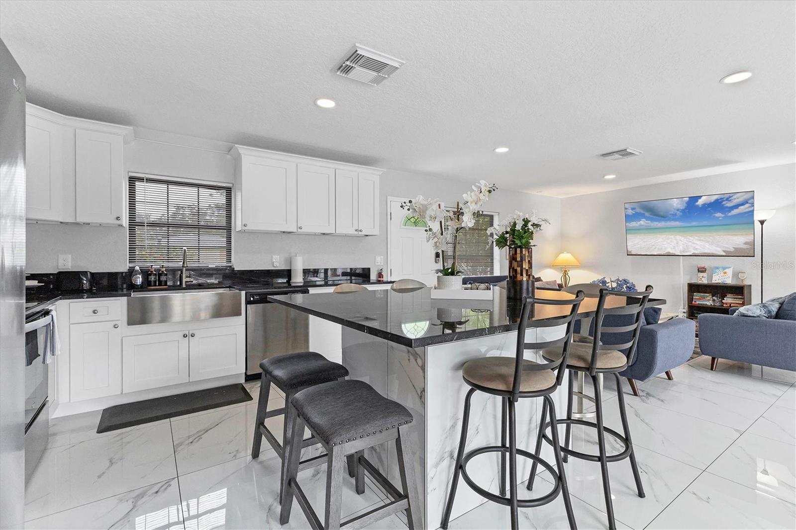 Dine while watching your favorite show or entertain guests around this incredible multi-purpose island!