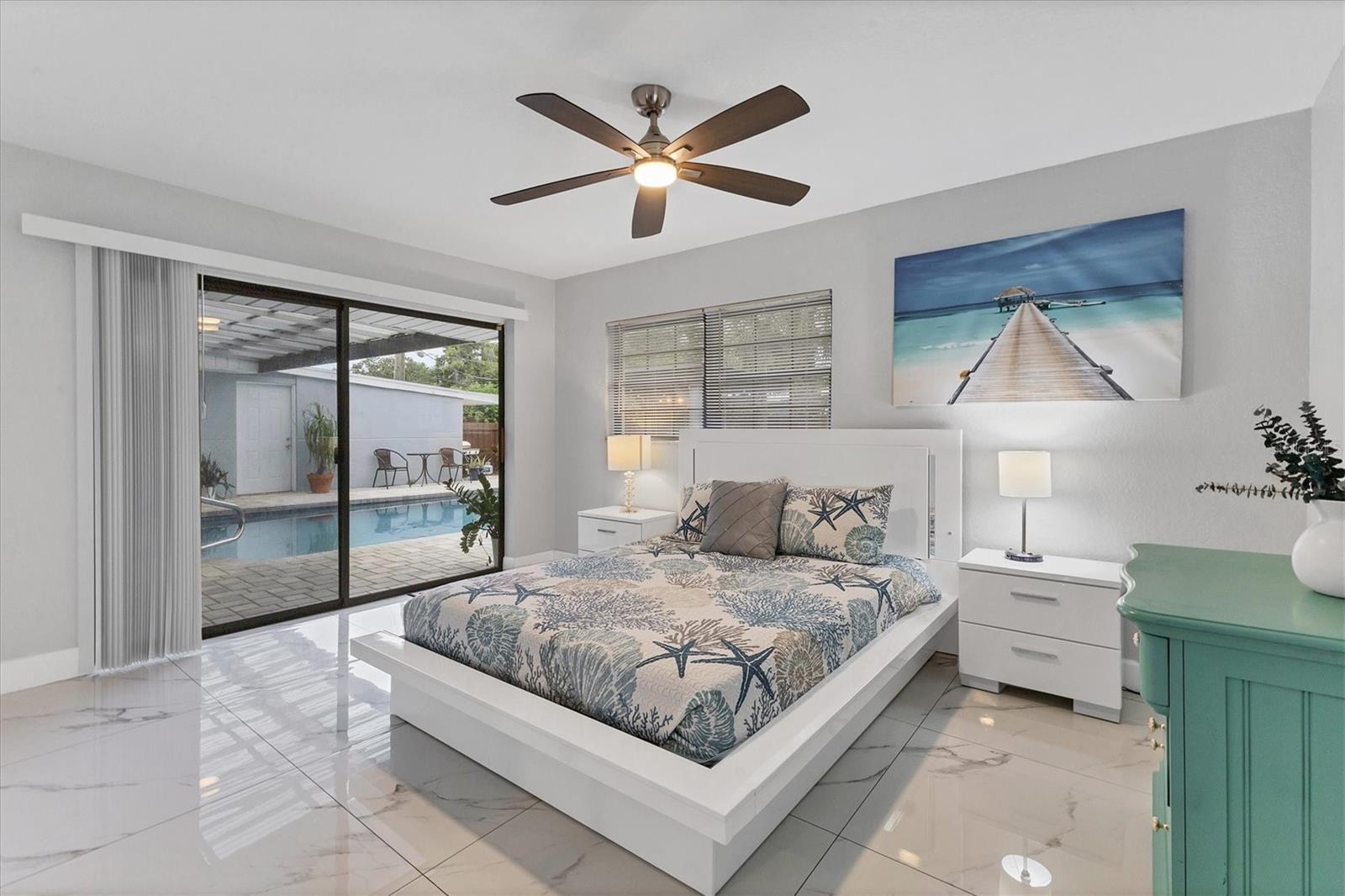 Bedroom 2 is at the back of the right side of the house and overlooks the pool and patio.