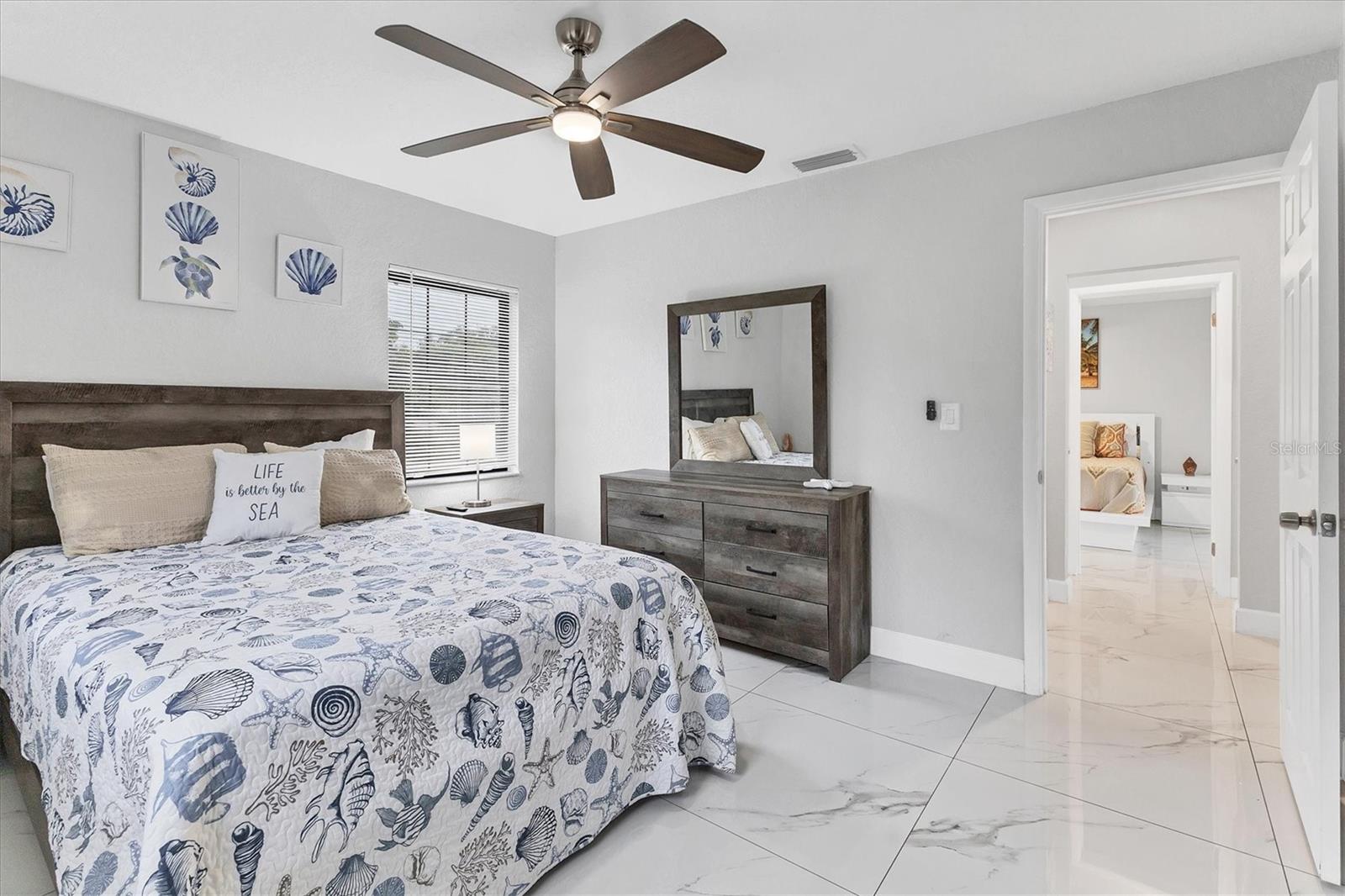 Bedroom 4 also features a large built-in closet with mirrored doors.