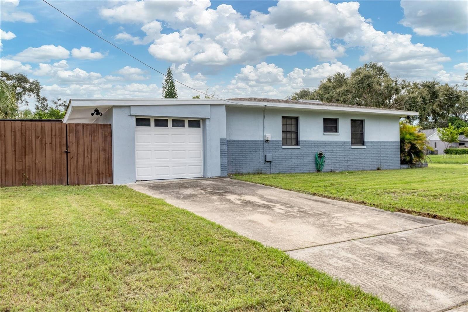 Garage faces side of house and offers an additional driveway/parking area.