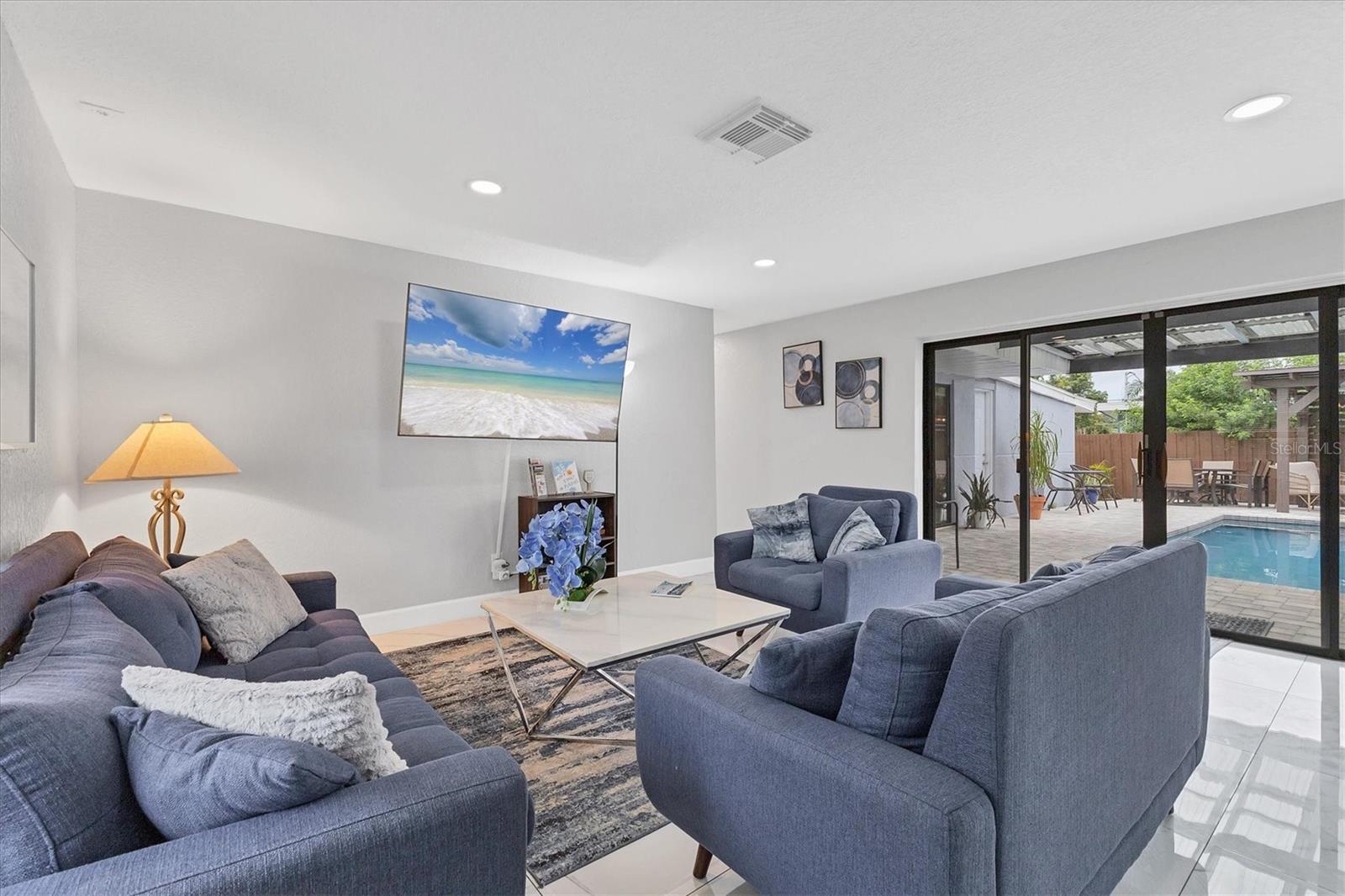 Enter home into great room with living area to the left
