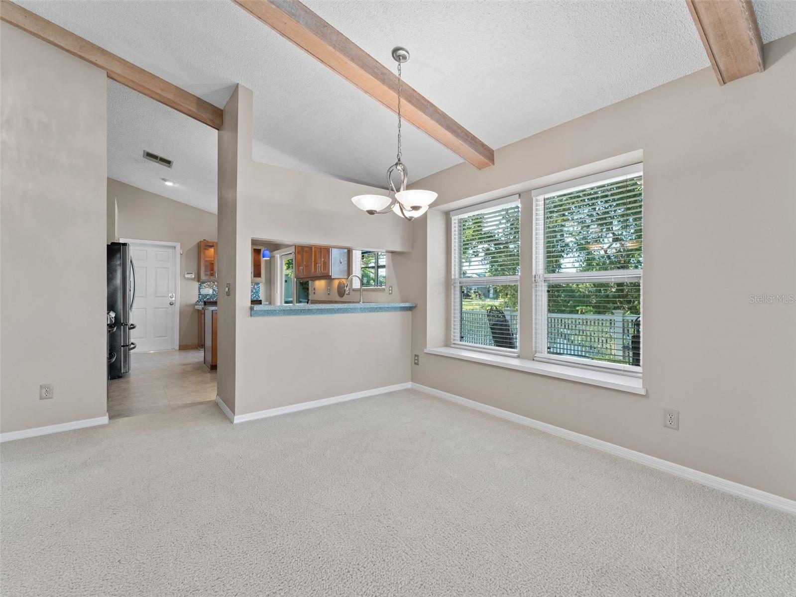 Elegant dining room with plenty of natural light — perfect for family meals or entertaining guests