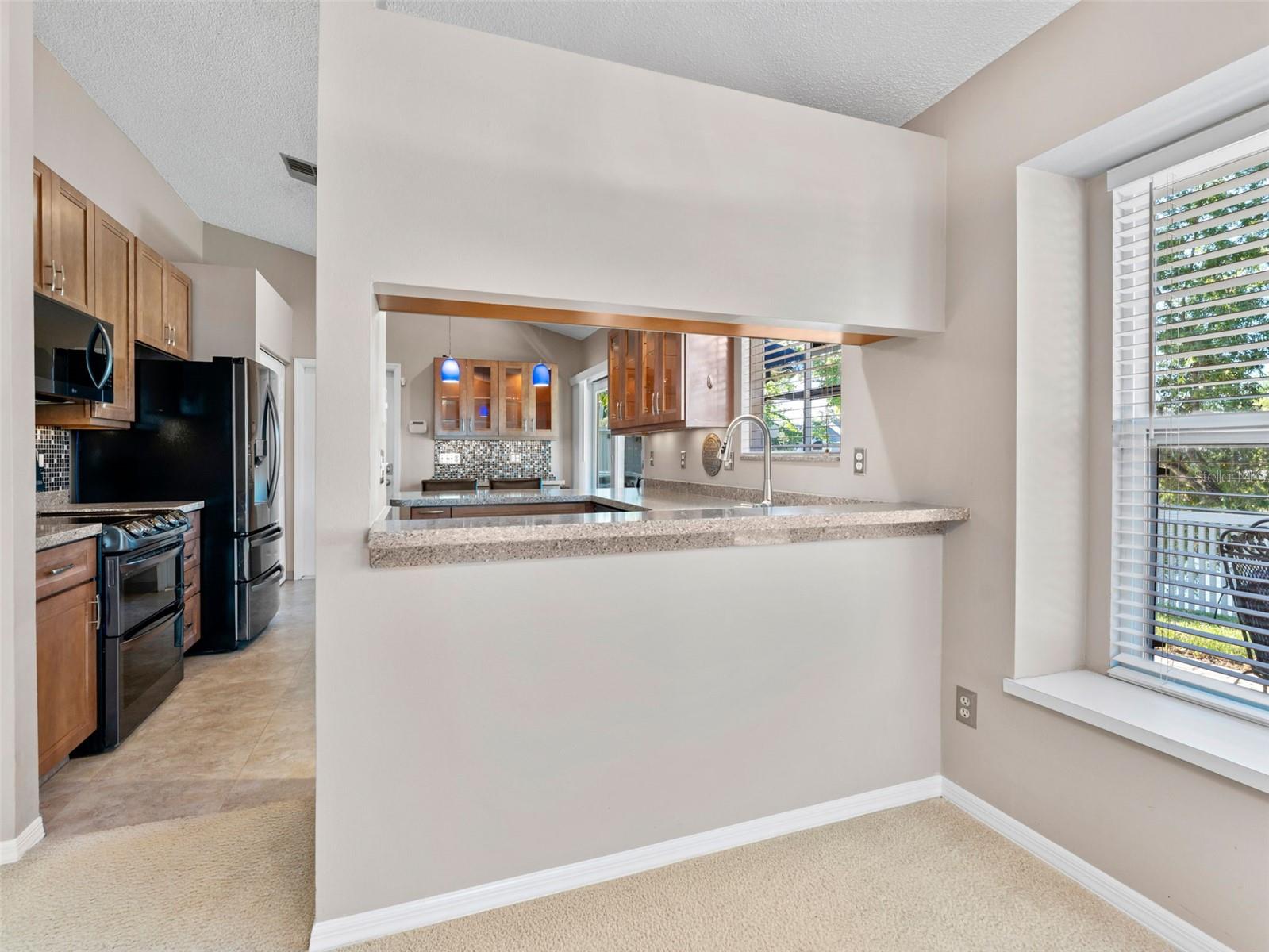 Functional overhang bar overlooking the kitchen — perfect for casual meals, entertaining, or morning coffee