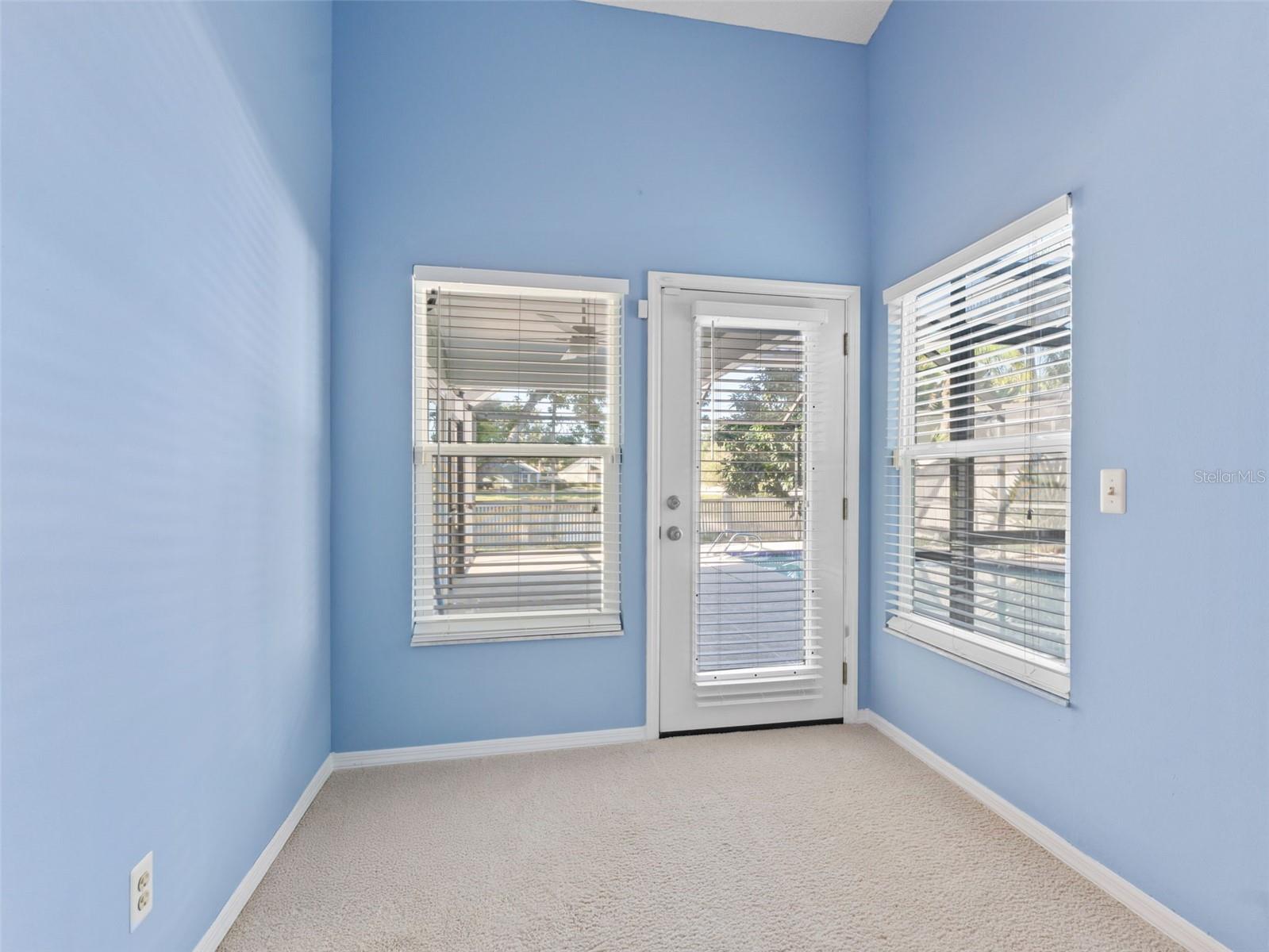 Bonus space in the primary suite creates the perfect reading nook or home office, with direct access to the pool area