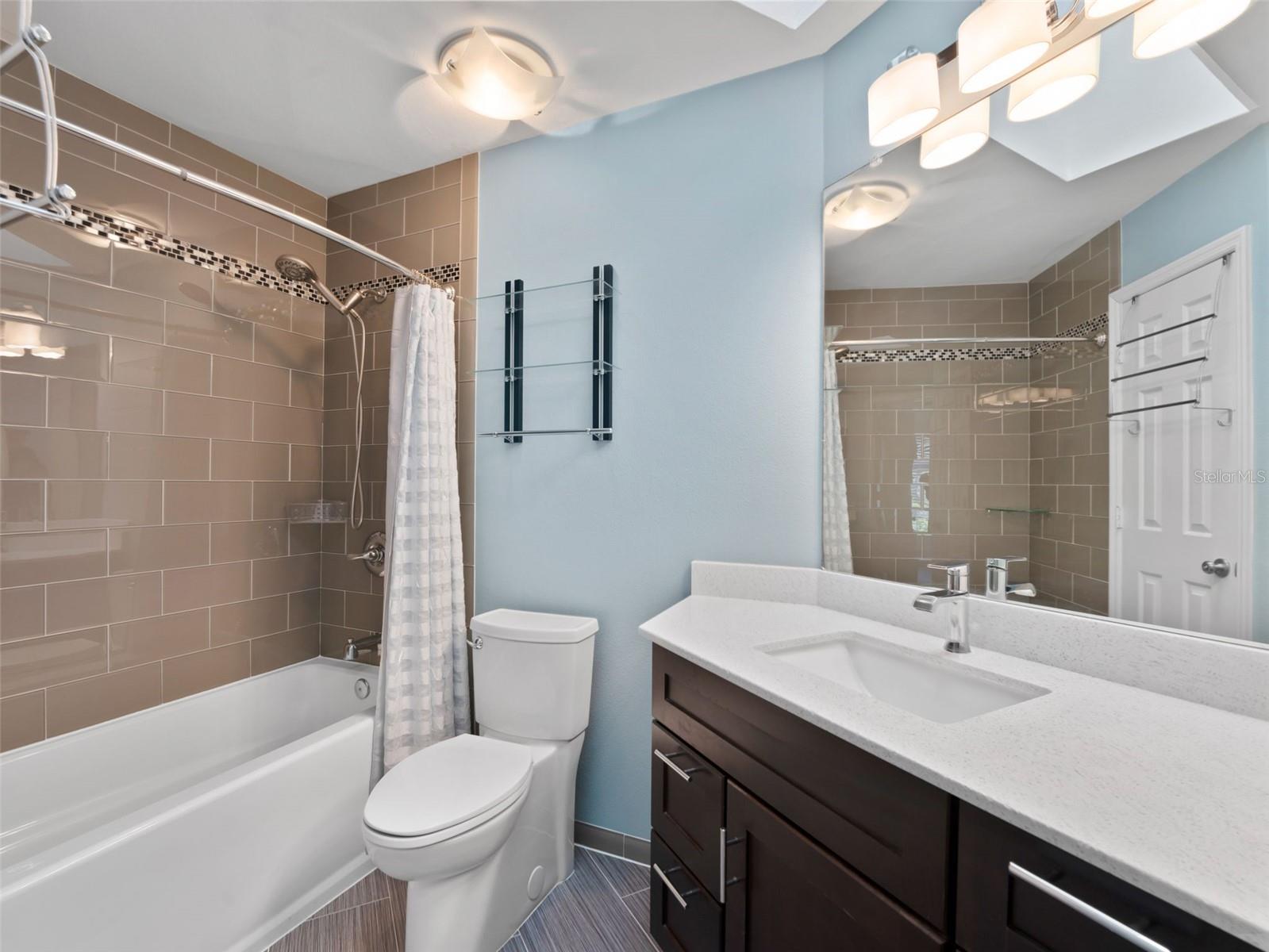 Beautifully updated hall bathroom with a large soaker tub — perfect for relaxing and unwinding
