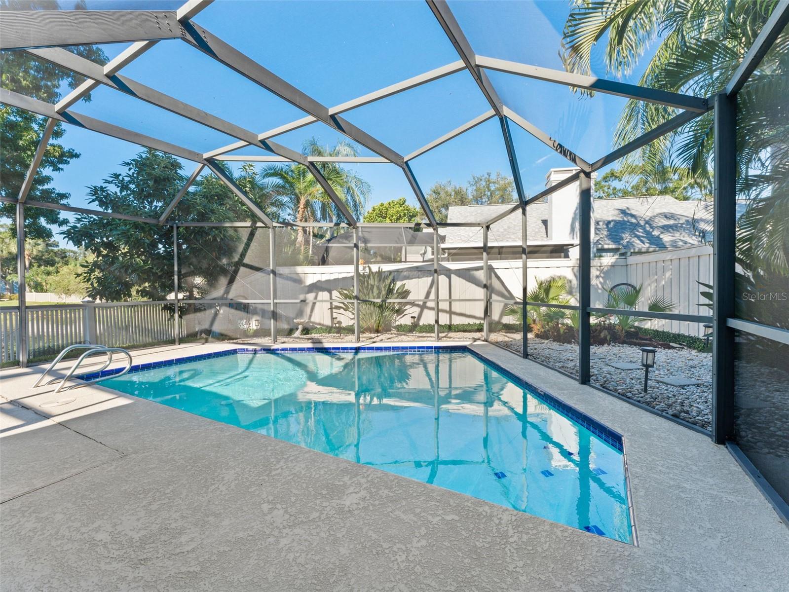 Screened-in pool — a private oasis perfect for relaxing, swimming, and entertaining year-round