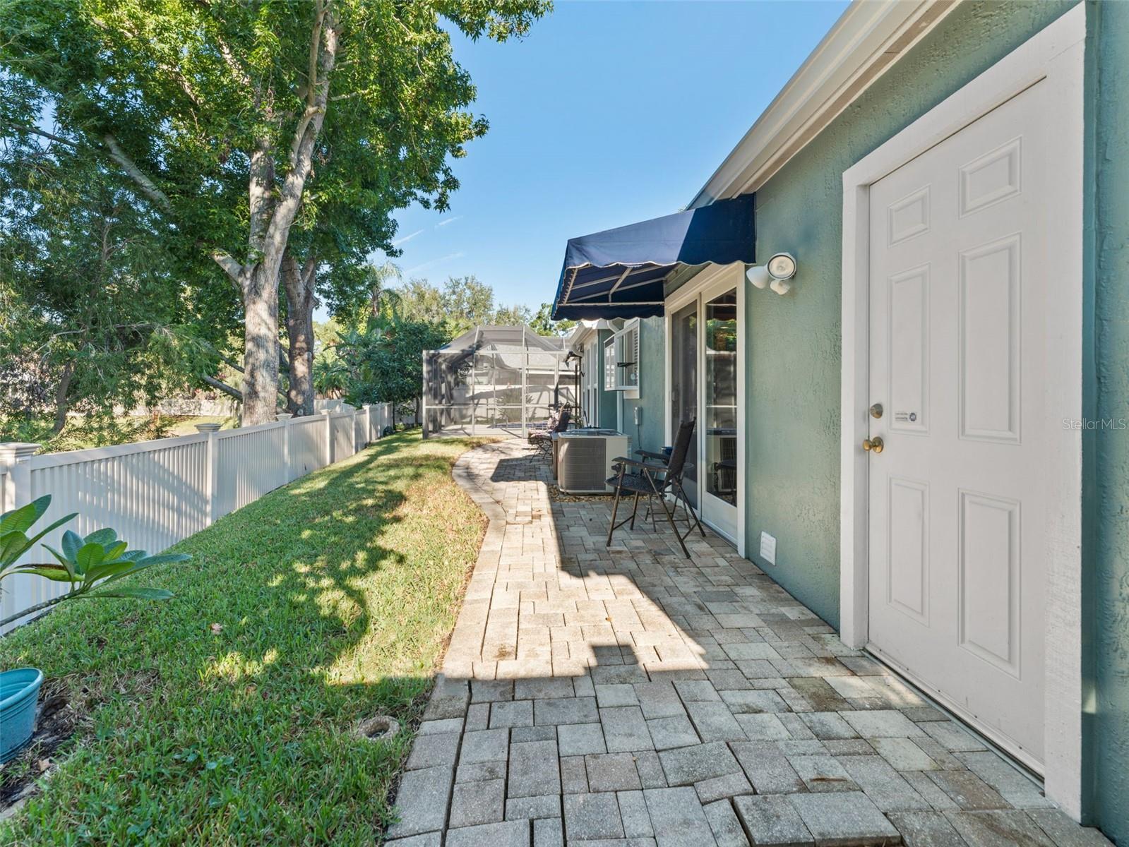 Very private, fenced-in yard overlooking the pond — perfect for pets, play, or peaceful relaxation