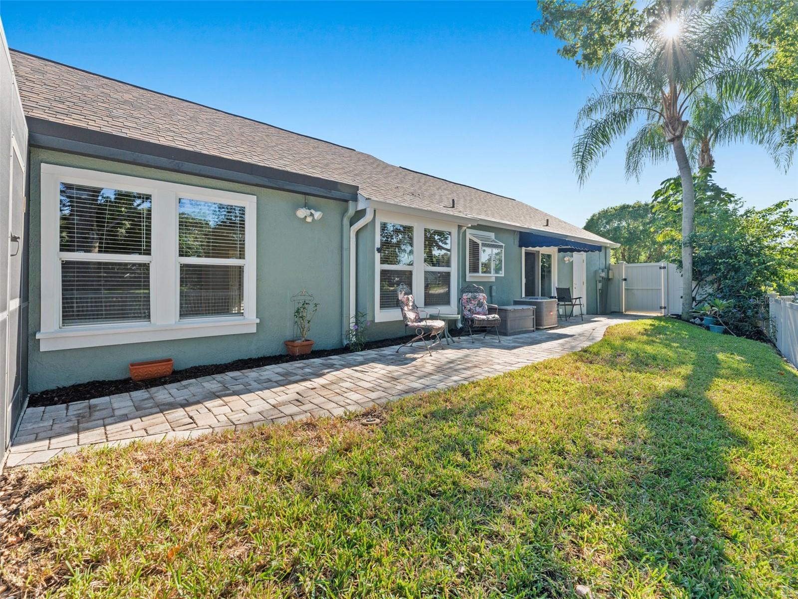 Beautifully landscaped yard — lush greenery and thoughtful design enhance the home’s curb appeal and outdoor enjoyment