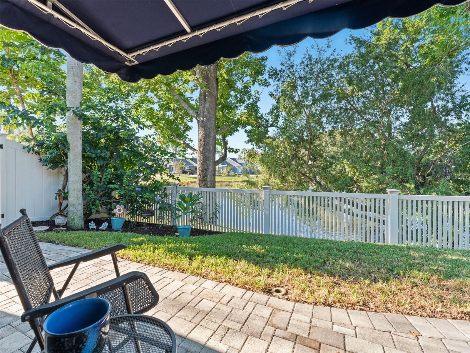 Cozy backyard sitting area overlooking the pond — the perfect spot to relax and enjoy serene views