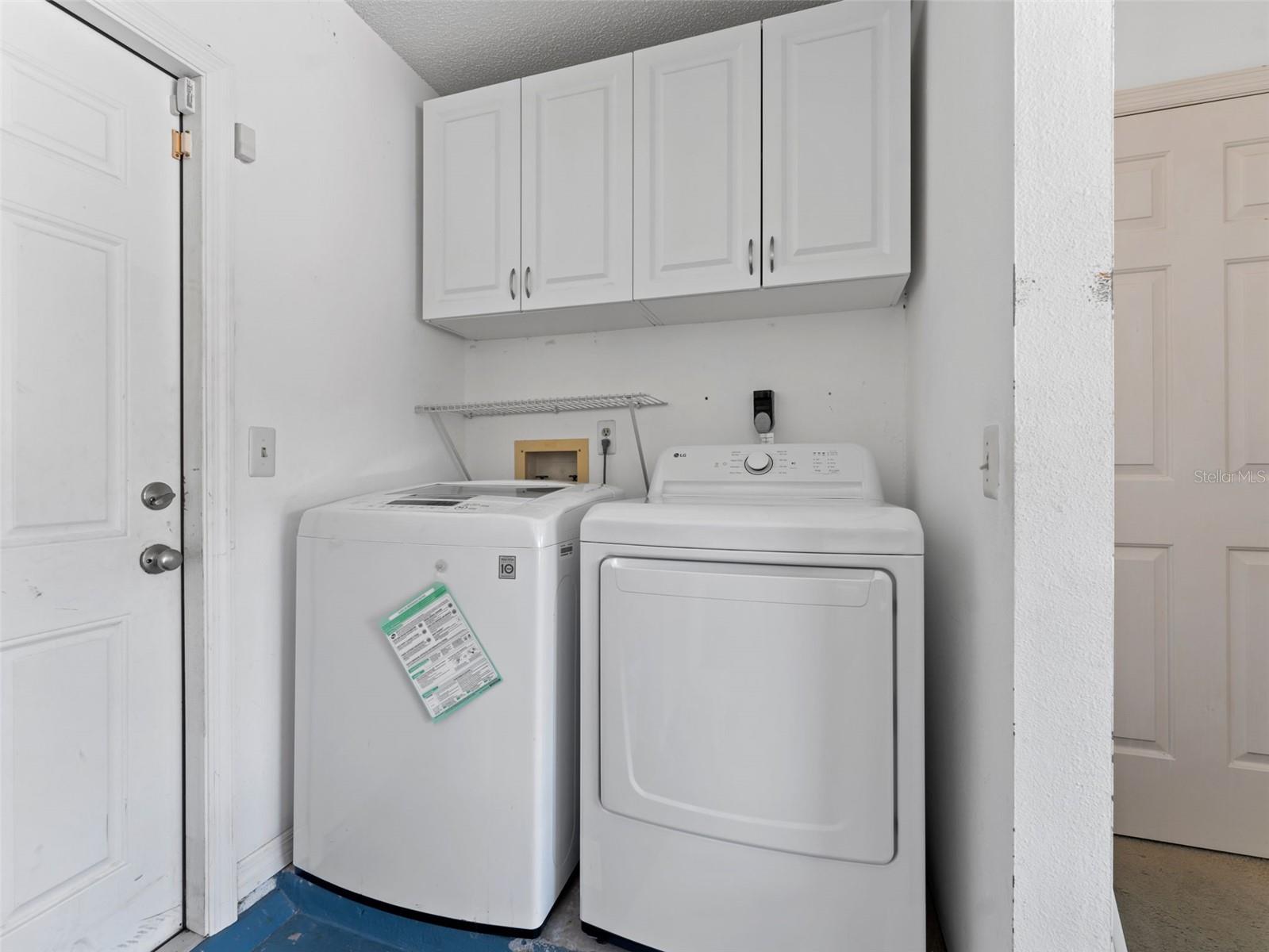 Convenient washer and dryer located in the garage — functional laundry space with plenty of room