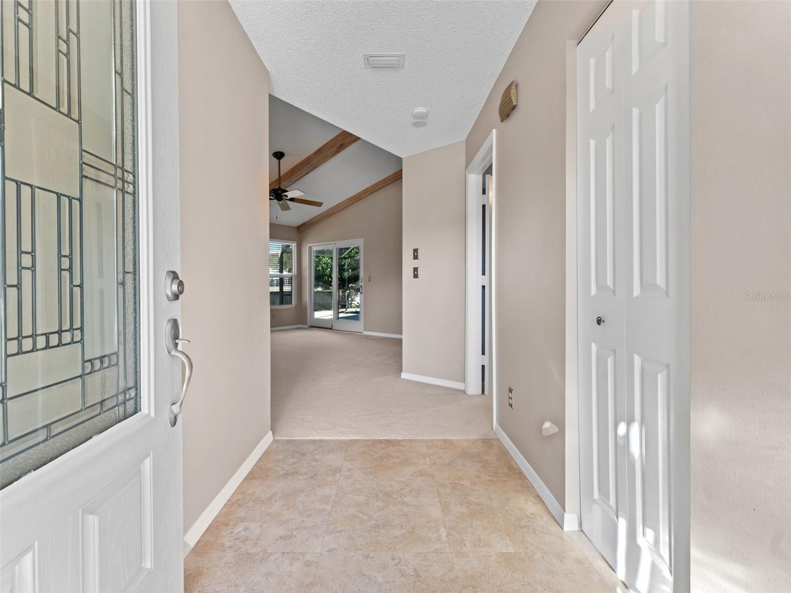 Step inside to a bright foyer with a convenient coat closet — the perfect welcome home