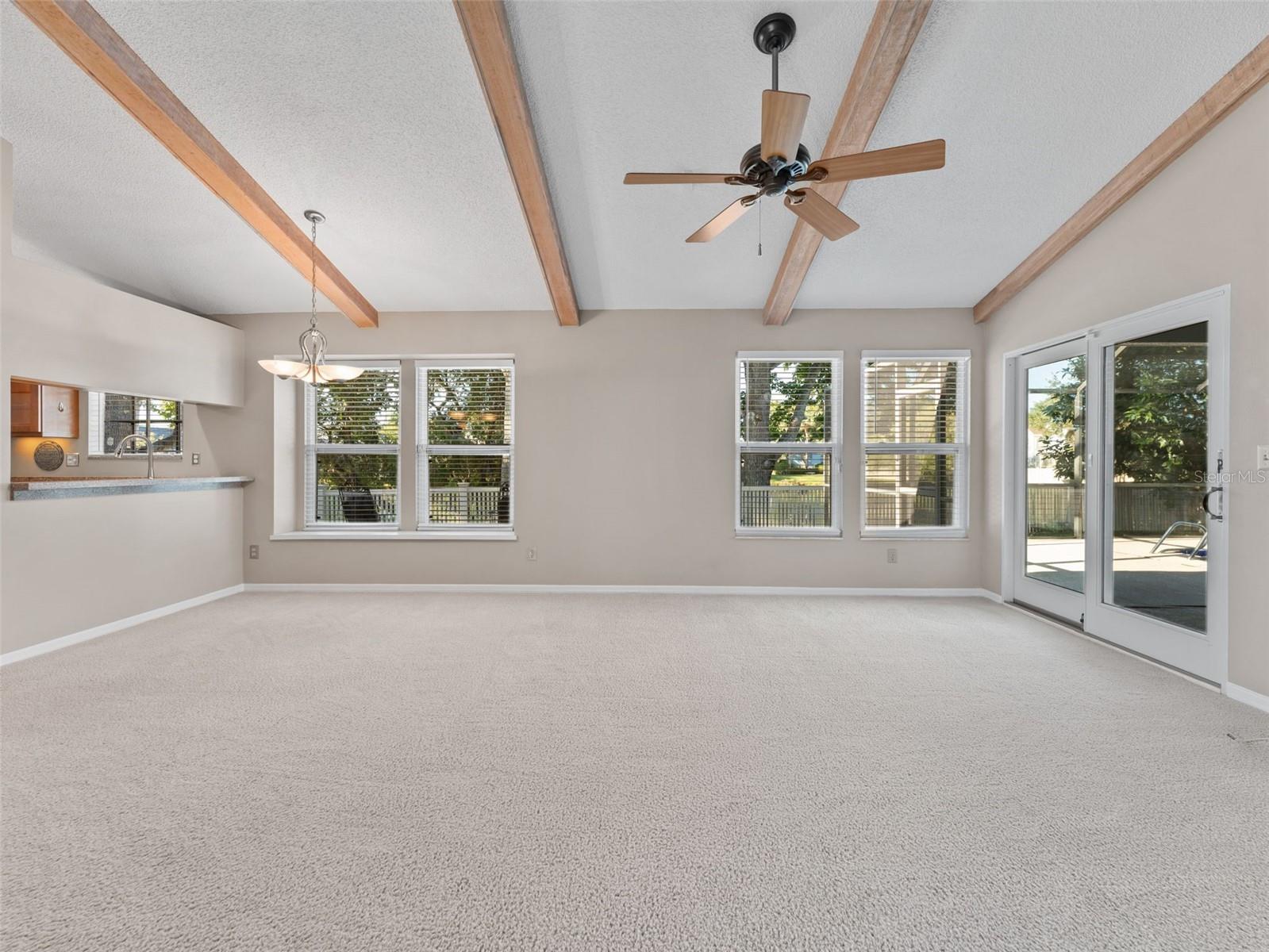 A clean, bright living room filled with natural light — the perfect space to relax or entertain