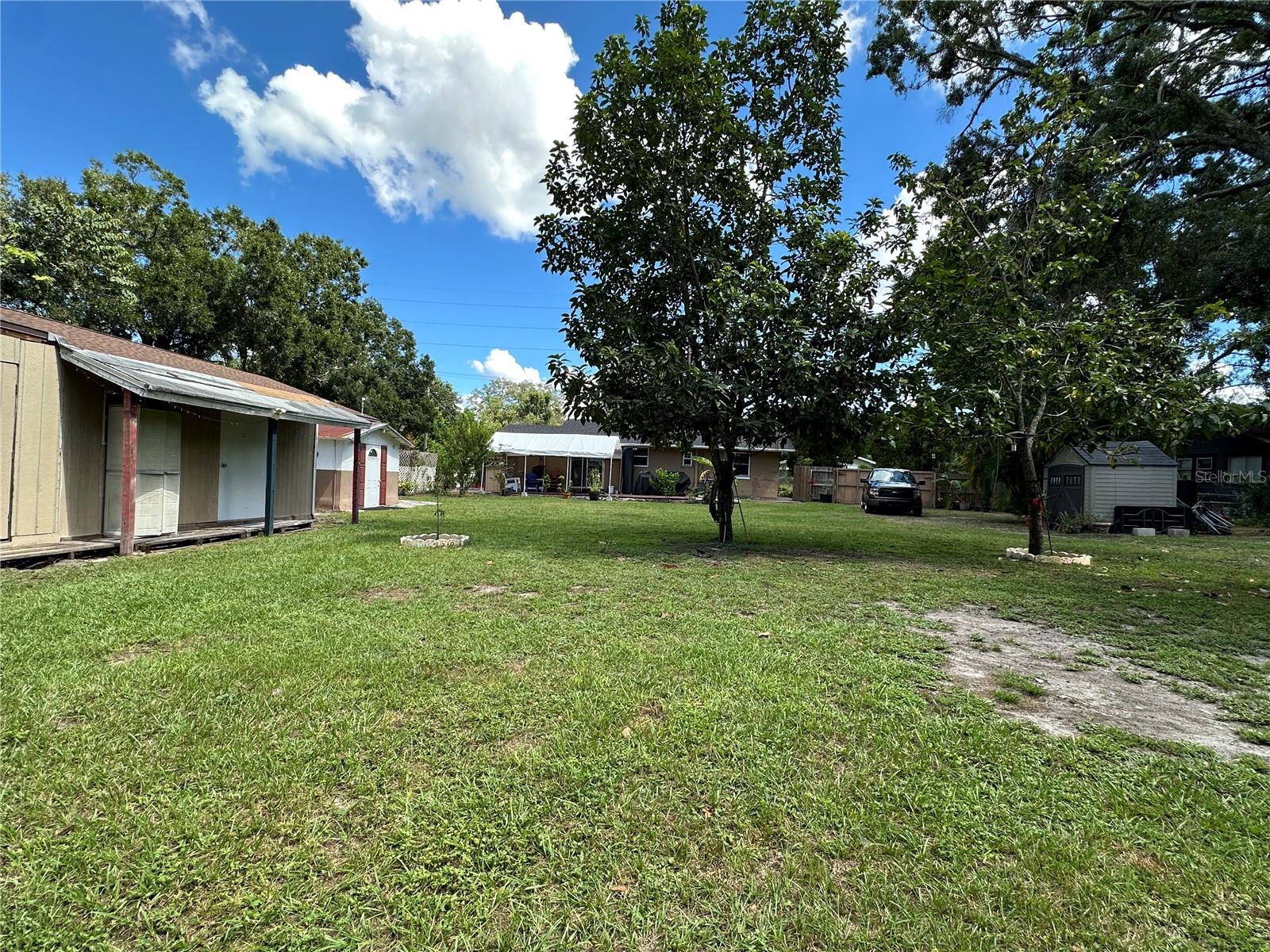 View from the back of the yard looking at the house.