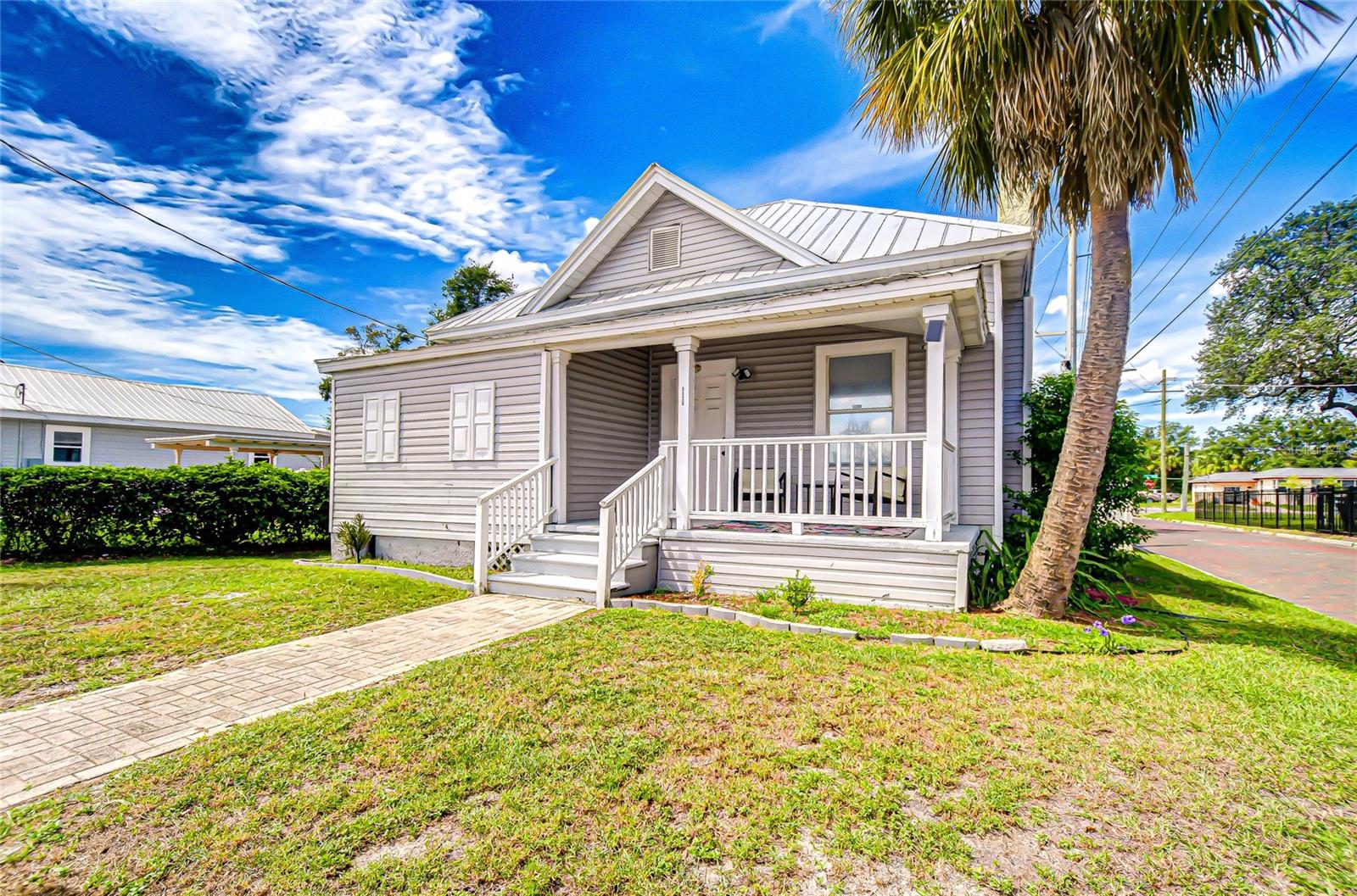 Charming bungalow with a welcoming front porch, metal roof, and timeless curb appeal. Situated on a corner lot with a spacious yard, this home offers both character and convenience in a vibrant location.