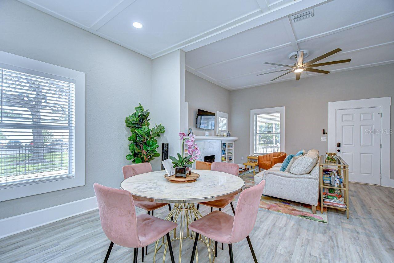 The dining area boasts a modern, airy feel with large windows and stylish finishes. Its open layout flows seamlessly into the living room, creating a perfect space for entertaining and everyday living.