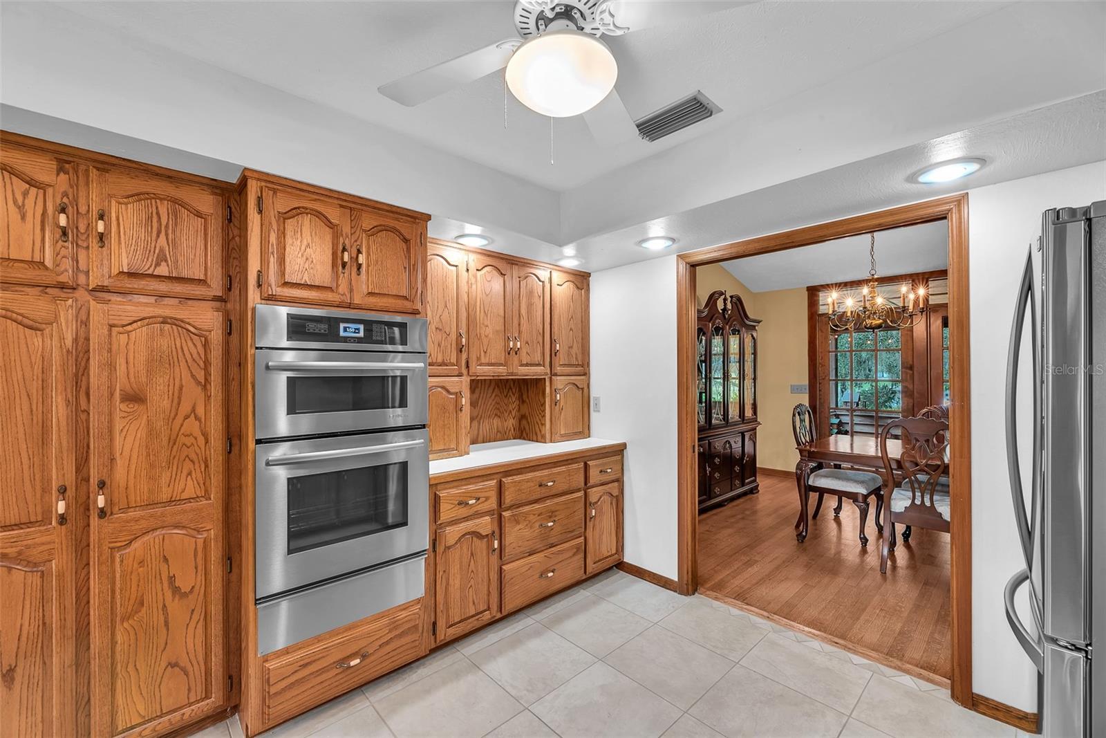 There are double pocket doors of solid oak between the kitchen and formal dining room.