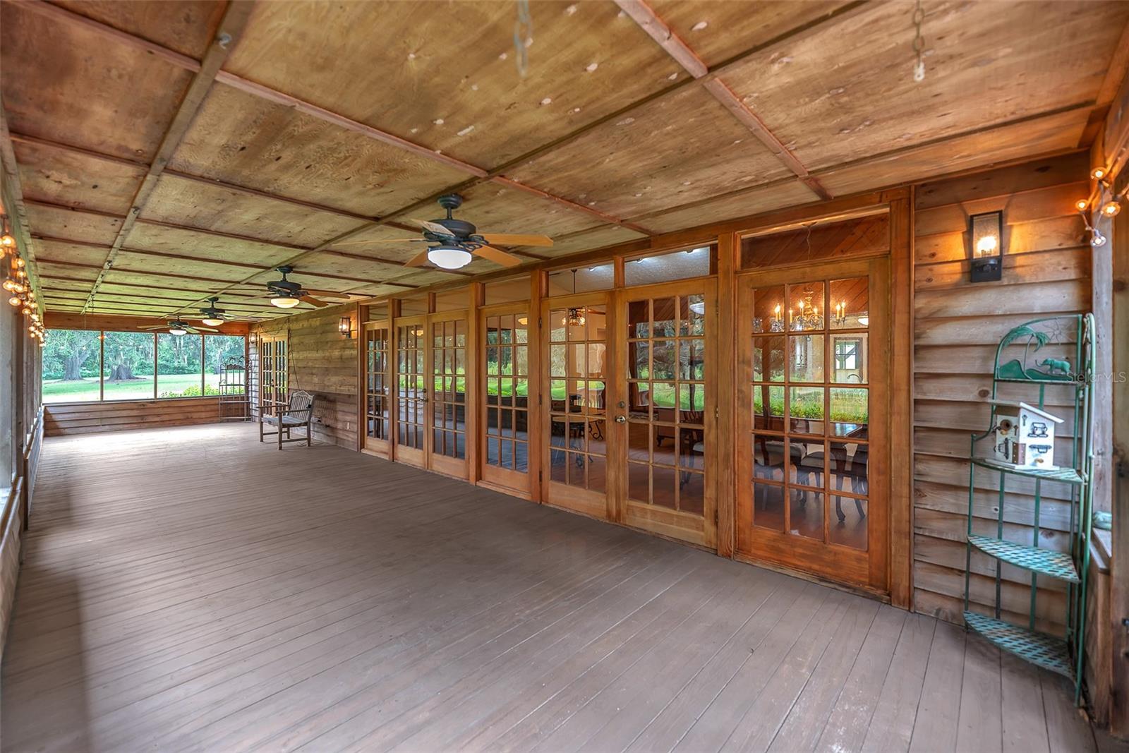 This screened in porch is 46'5" x 11'3" and is the perfect spot to watch spectacular sunsets over Long Pond Lake.