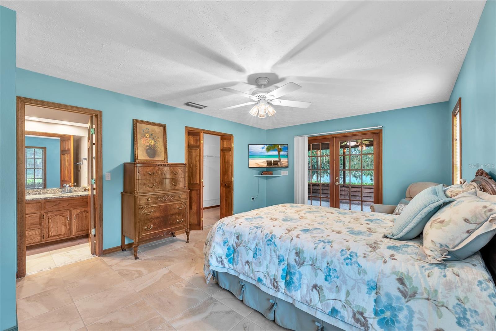 Owner’s suite has French door access to the back porch, a largec walk-in closet and a spa-like ensuite.