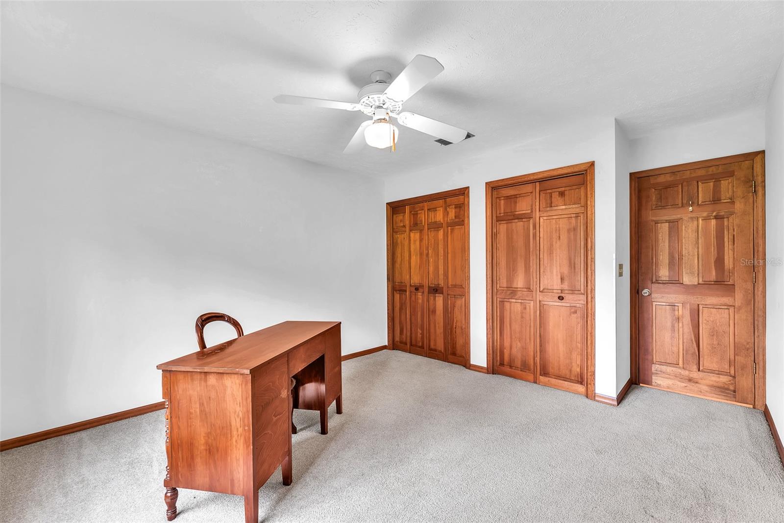 Bedroom #2 has two built in closets & ceilng fan.