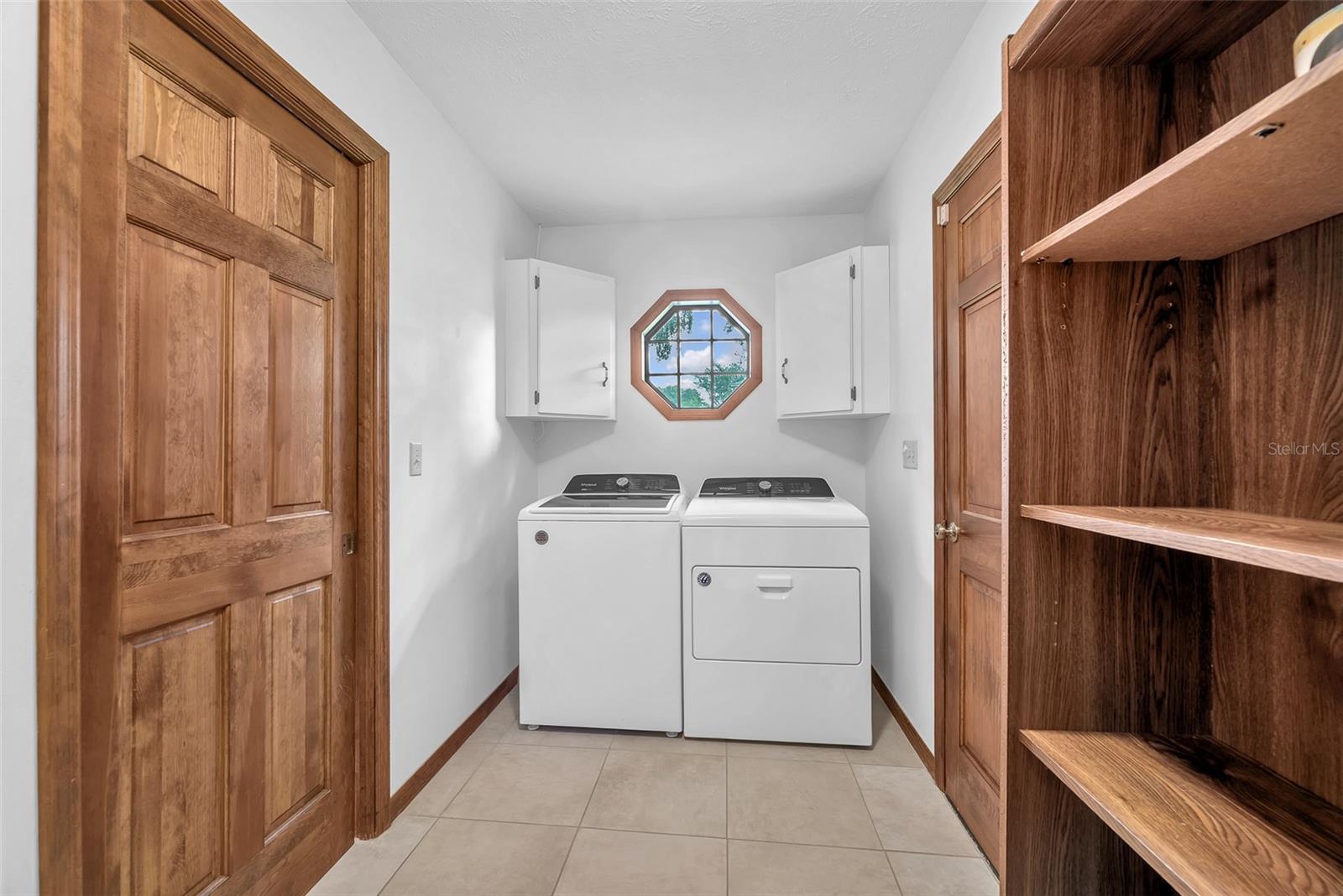 The laundry is steps from the kitchen for added convenience.