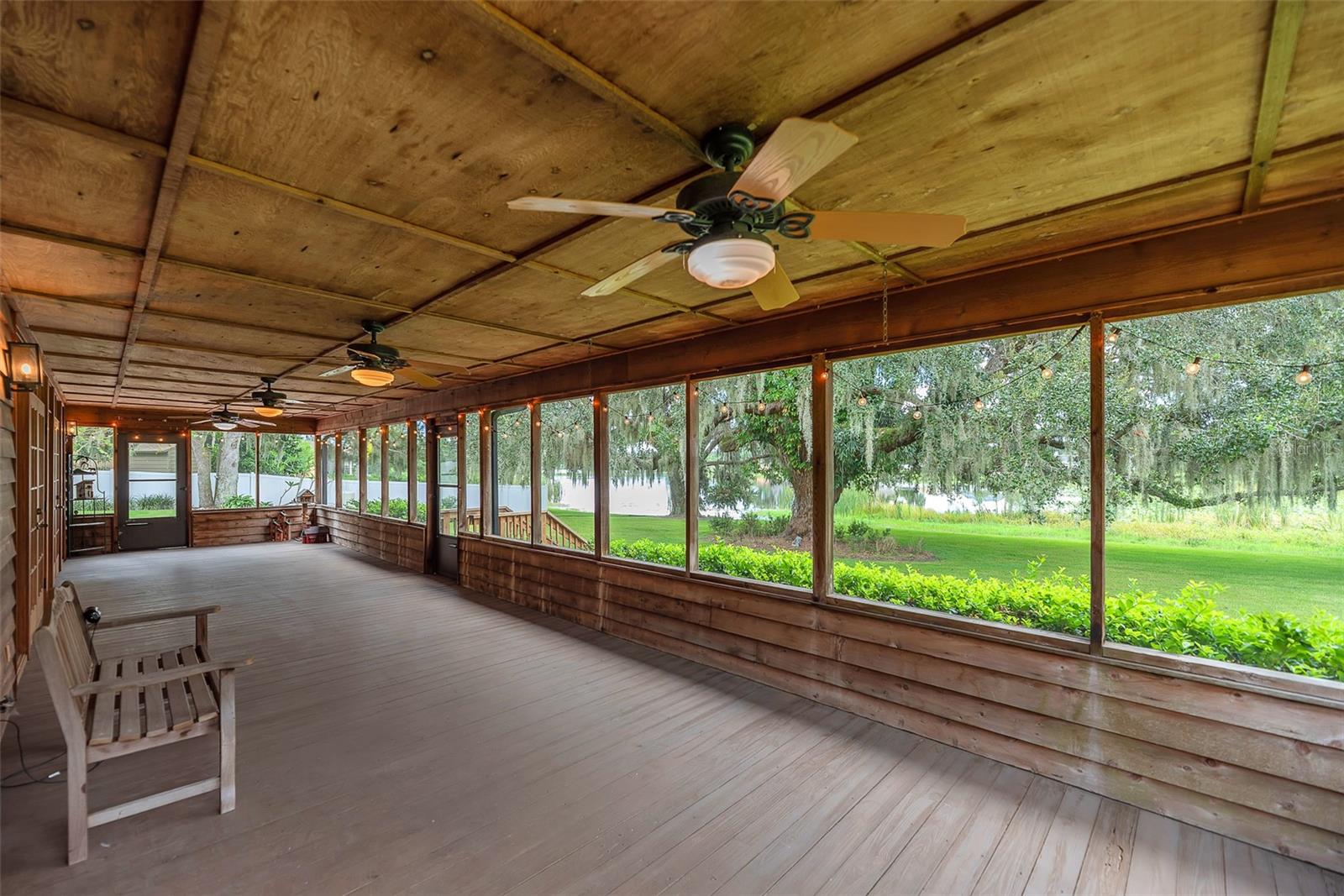 Expansive back porch with an unobstructed, million-dollar view of Long Pond