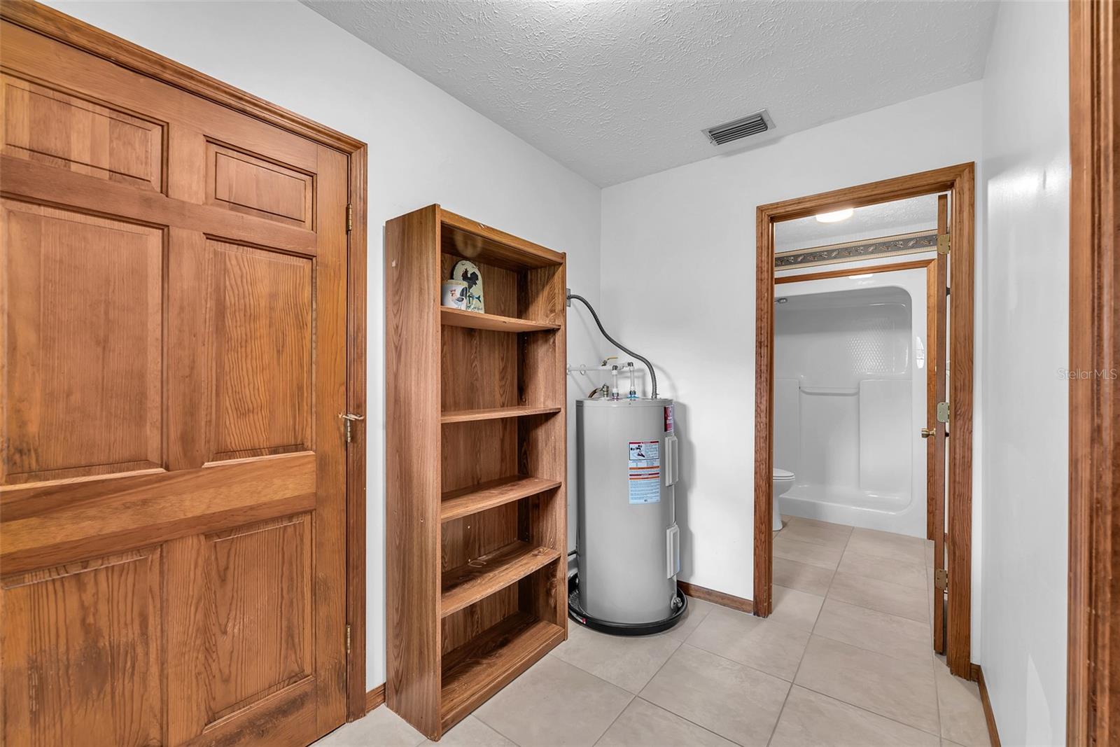 This area can couple as a mudroom just off the garage with room for storage.