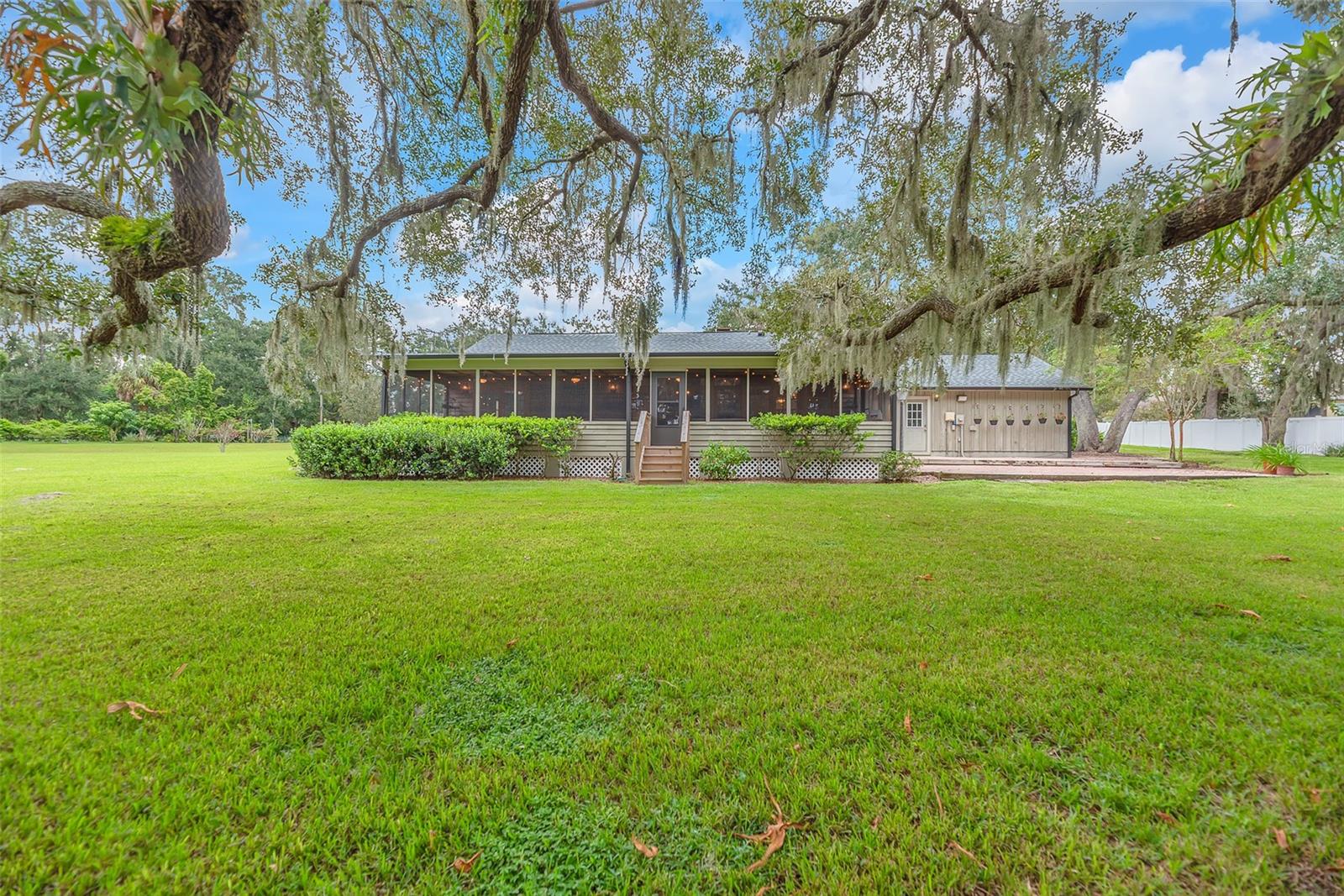 This treasured family homestead is nestled among towering Grandfather Oaks.