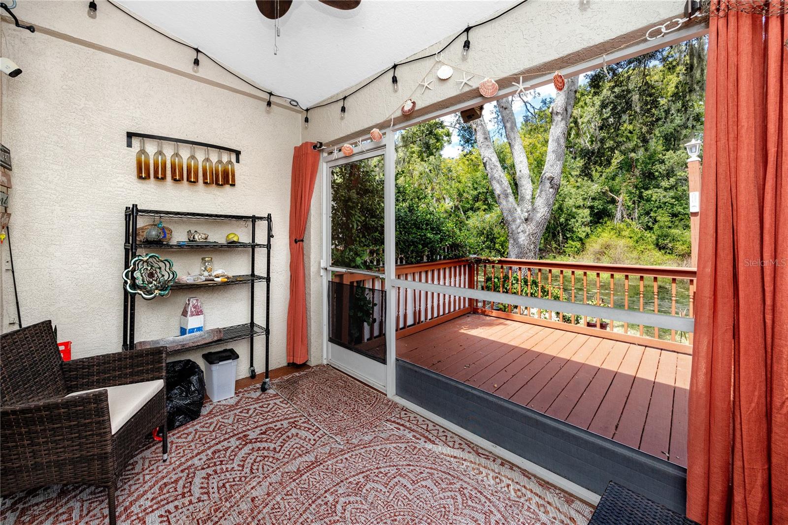 View from Florida room overlooking patio and creek