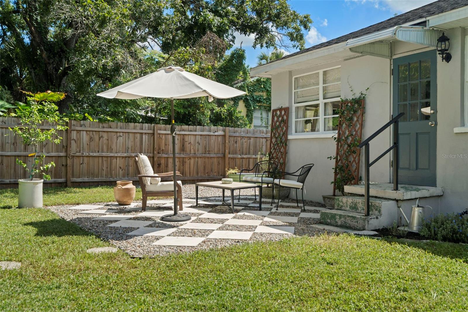 Backyard + Back Patio with professionally laid stonework
