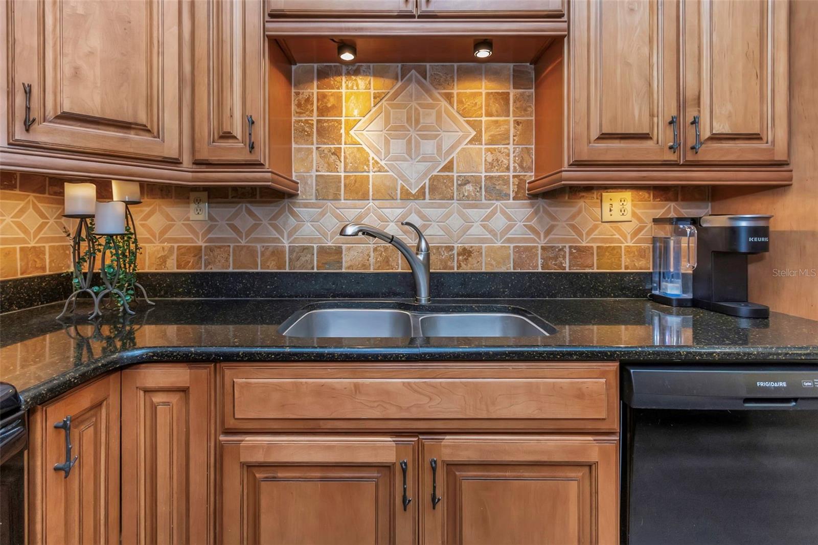 Kitchen complete with decorative tile backsplash.