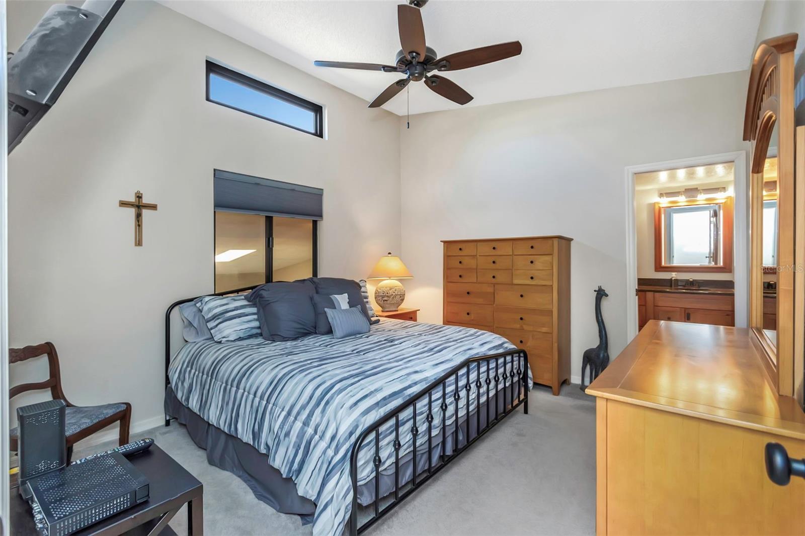 Primary Suite with en suite bathroom and large walk-in closet.