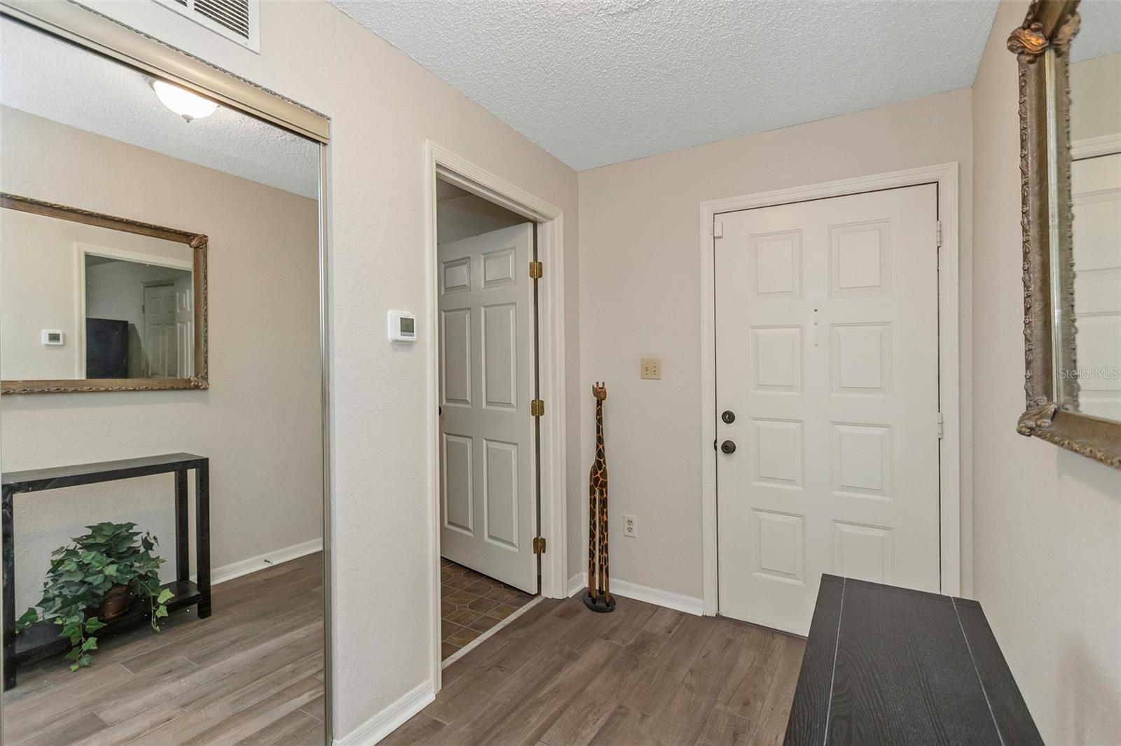 Front foyer leads outside or into the interior laundry/flex room.