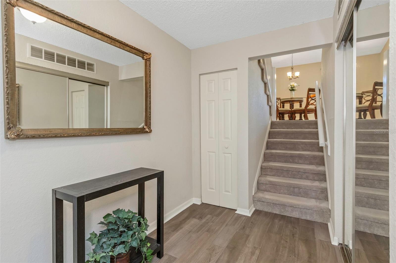 Front entry leads to the garage and large interior laundry/flex room.