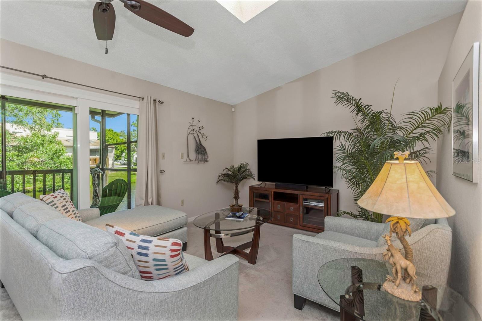 Second level contains the living/dining room combination, kitchen, and screen enclosed rear porch.