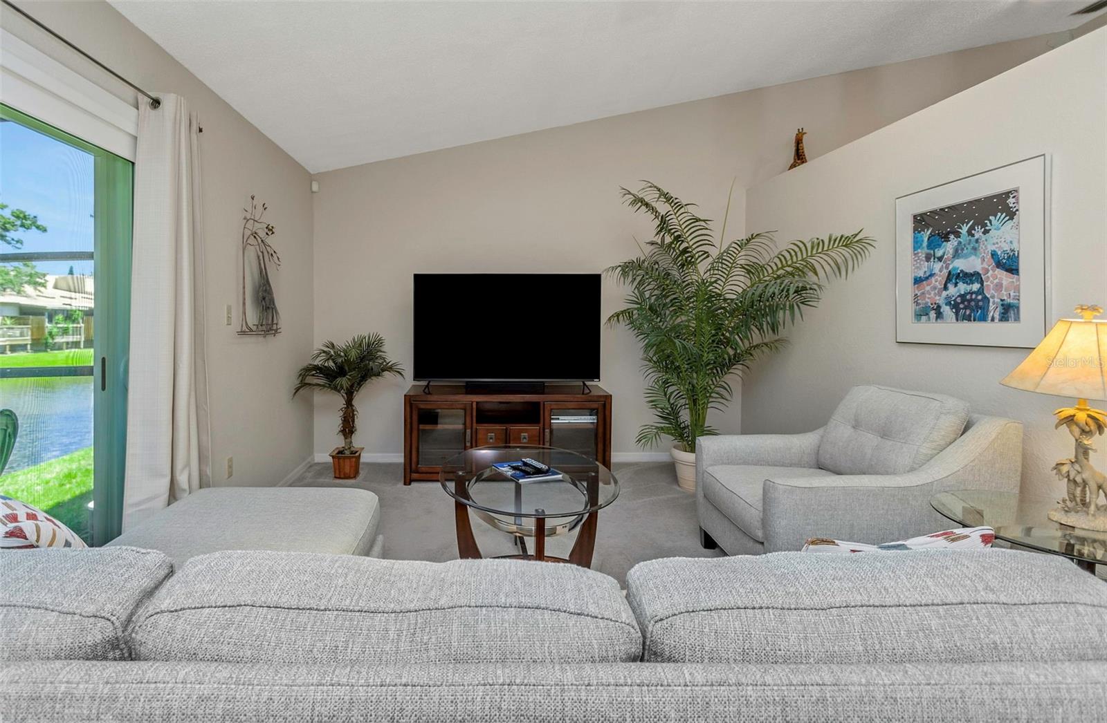 Living room with vaulted ceiling.