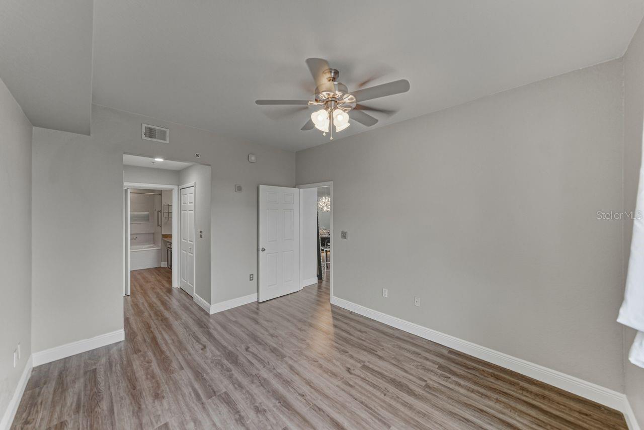 En-suite bathroom with two large closets.