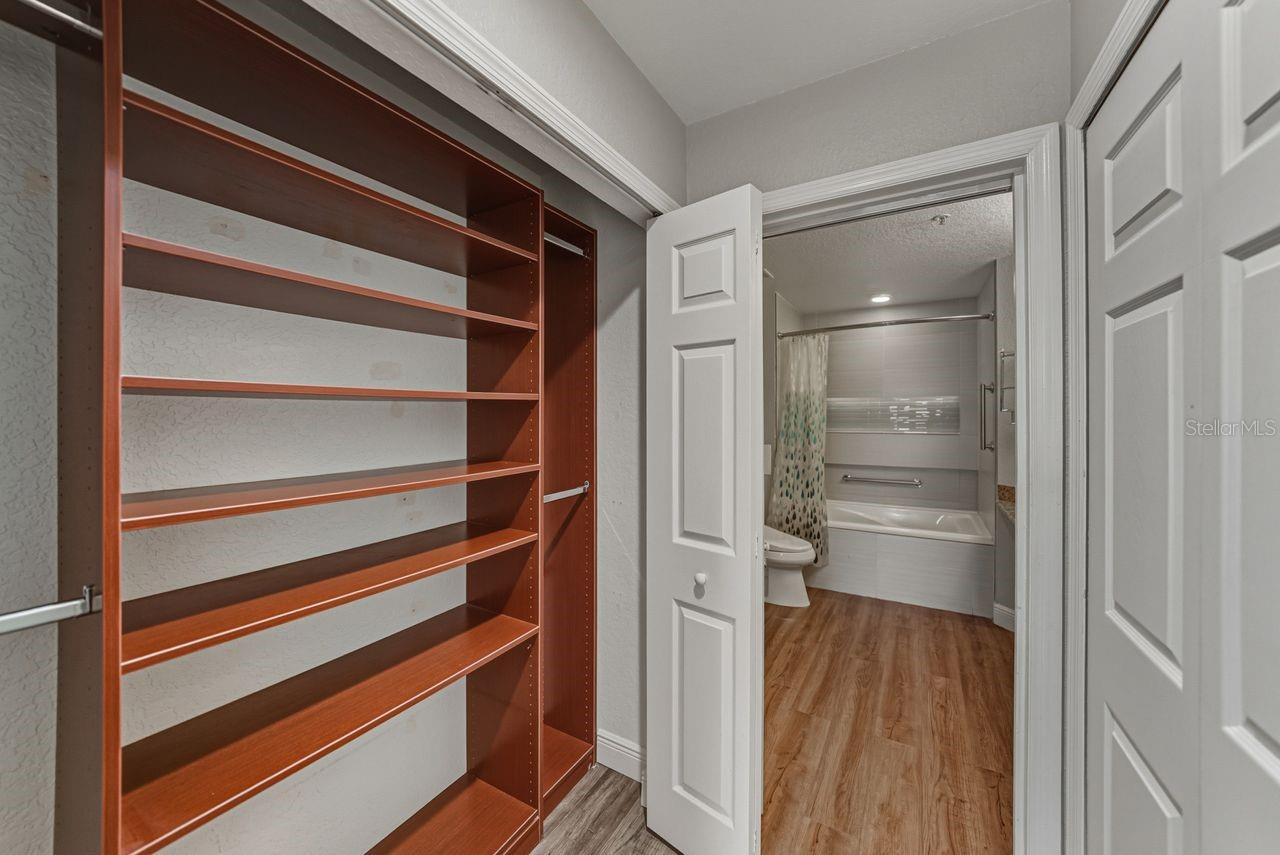 Primary bedroom has large walk-in closet with custom storage organizer.