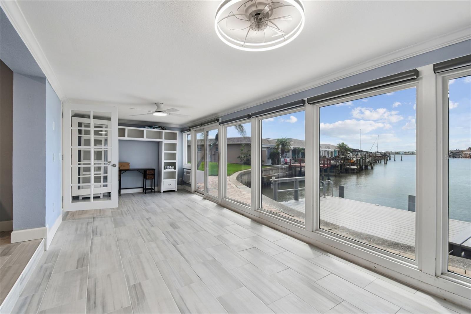 Air-conditioned Florida room with electric shades and tinted windows.