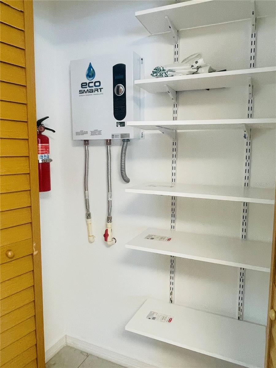 Tankless water heater and more kitchen storage.