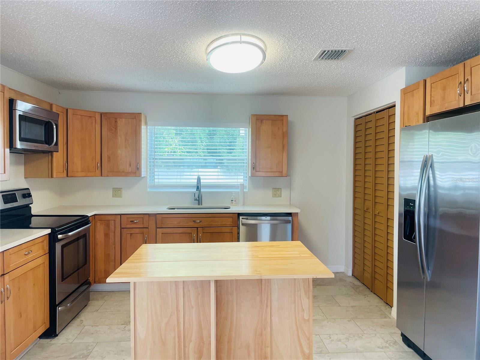 With a moveable island, you could replace it with table and chairs, if you prefer an eat-in kitchen.
