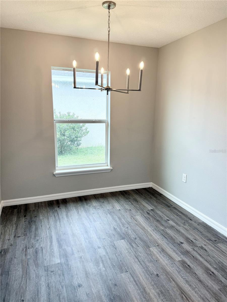 Spacious and modern kitchen features eat-in dining, newly installed quartz countertops, brand new stainless steel appliances, pantry and breakfast bar