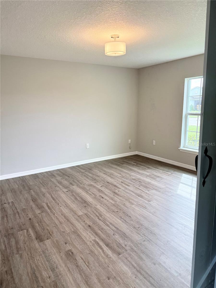 Spacious formal dining room with sliding barn door