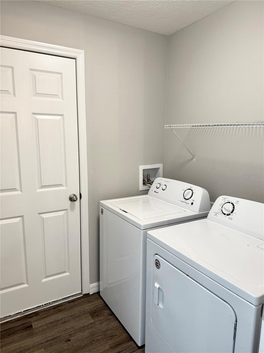 Laundry room accessible from kitchen and garage with washer and dryer included
